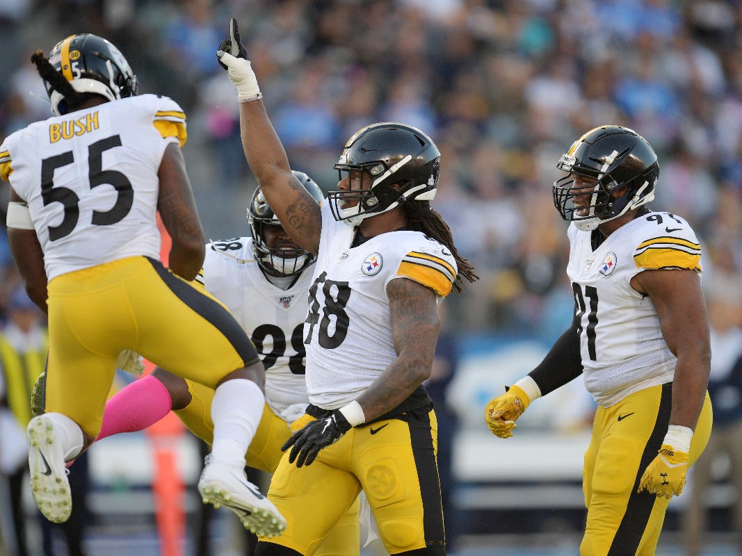 The Steelers' defense celebrates a tackle in the team's Oct. 13 game against the Los Angeles Chargers 