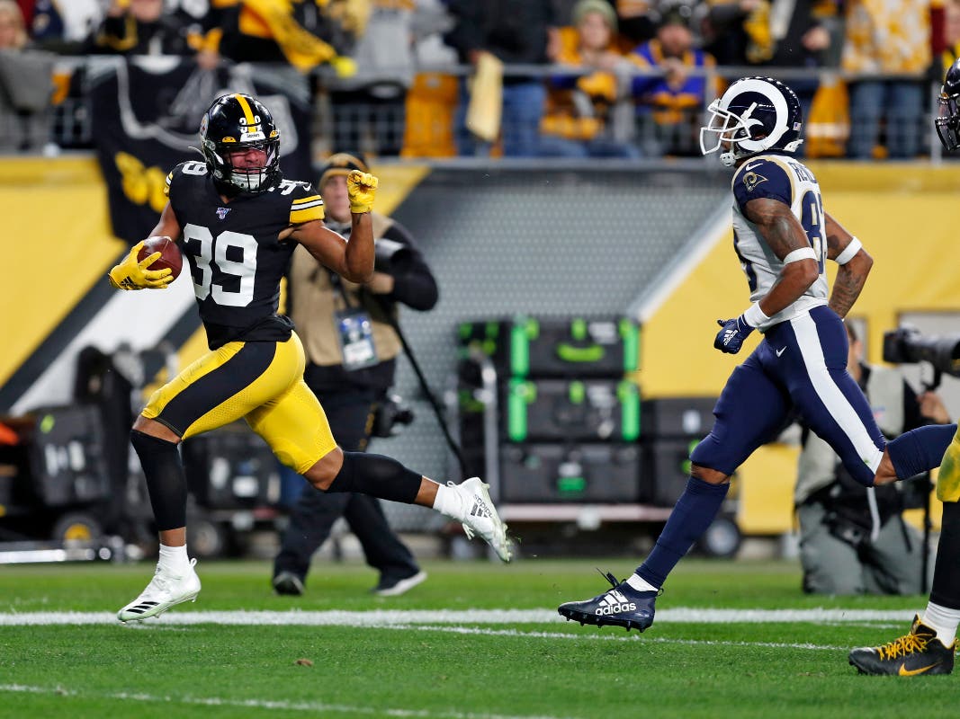 Pittsburgh Steelers free safety Minkah Fitzpatrick (39) heads for the end zone for a touchdown after intercepting a pass from Los Angeles Rams quarterback Jared Goff (not shown) during the first half of an NFL football game in Pittsburgh, Sunday, Nov. 10,