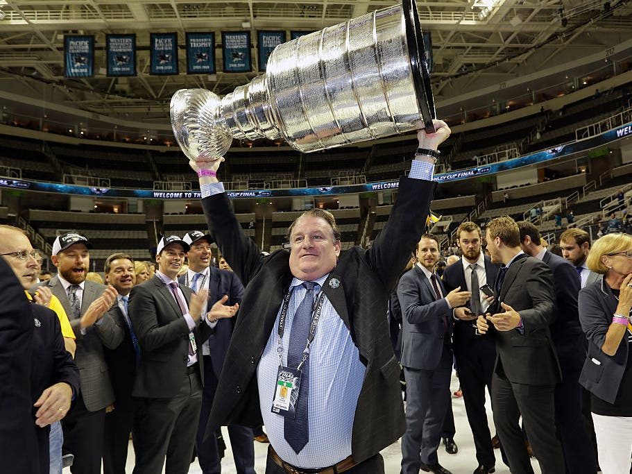 Former Penguins minor league coach Clark Donatelli holds the Stanley Cup after the Pens won the cup finals in 2016. 