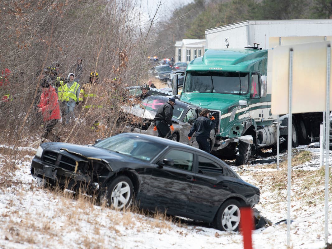 Emergency personnel work at the scene of a multi-vehicle crash on Interstate 81 North near the Minersville exit in Foster Township, Pa., Monday, March 28, 2022.