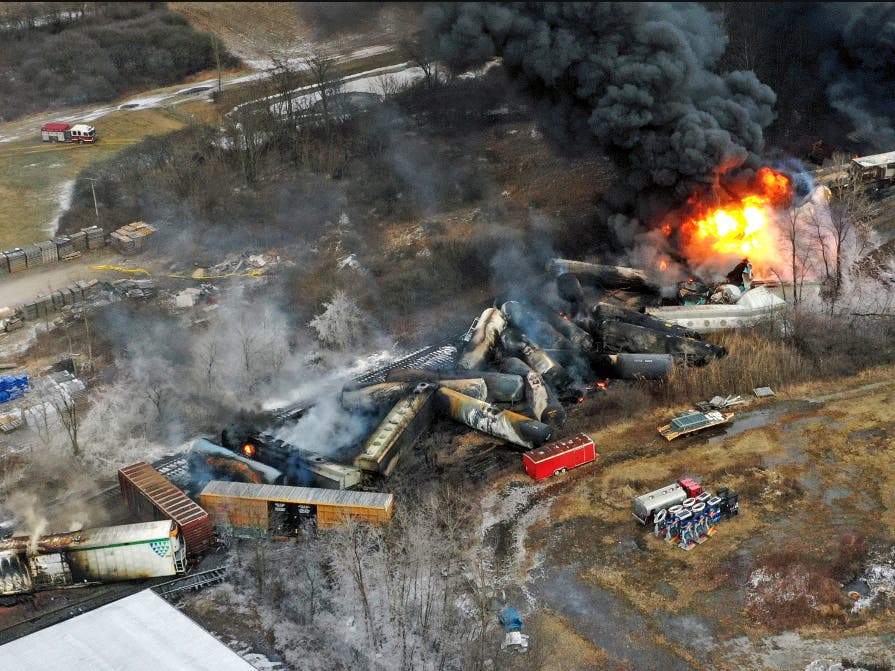 FILE - In this photo taken with a drone, portions of a Norfolk Southern freight train that derailed the previous night in East Palestine, Ohio, remain on fire at mid-day on Feb. 4, 2023.