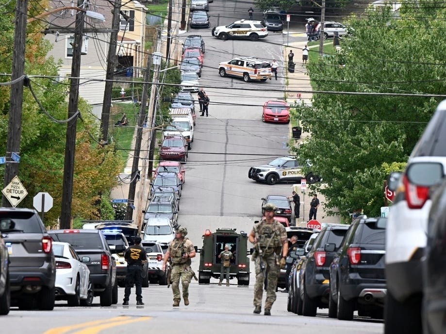 Pittsburgh police and other law enforcement personnel respond to gunfire in the Garfield neighborhood of Pittsburgh on Wednesday, Aug. 23, 2023. 