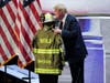 Republican presidential candidate former President Donald Trump kisses the helmet of Corey Comperatore during the Republican National Convention Thursday, July 18, 2024, in Milwaukee.