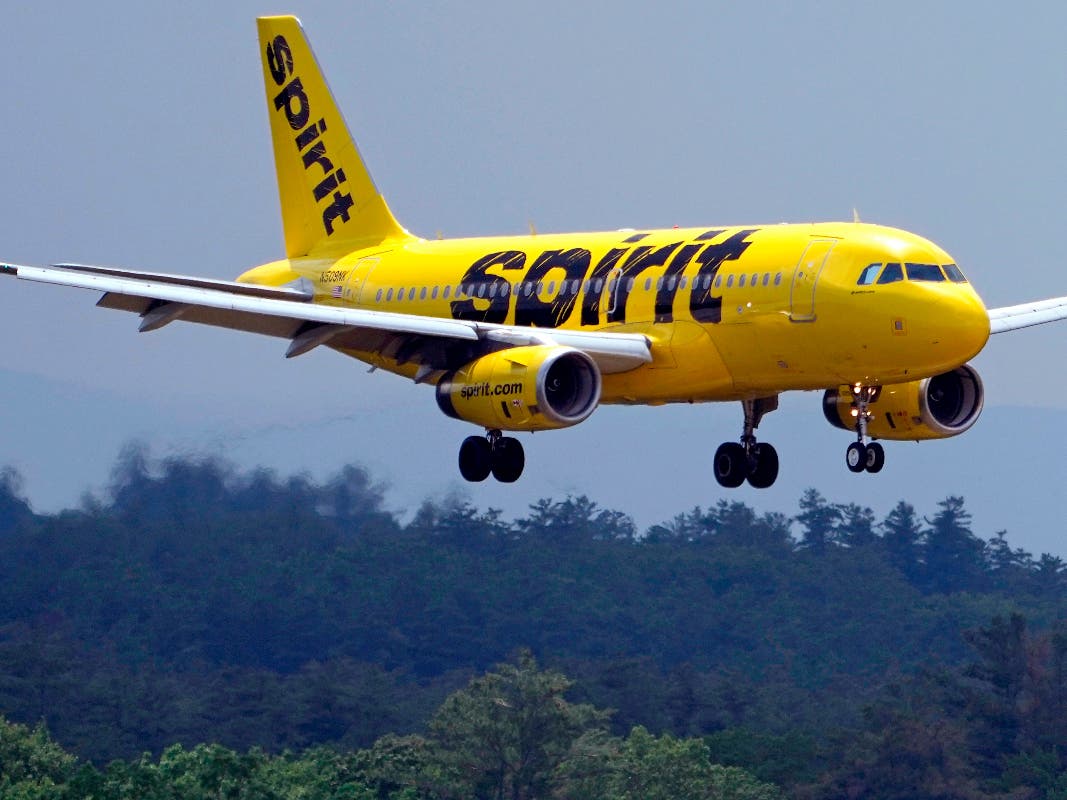 FILE - A Spirit Airlines 319 Airbus approaches Manchester Boston Regional Airport for a landing, June 2, 2023, in Manchester, N.H. 
