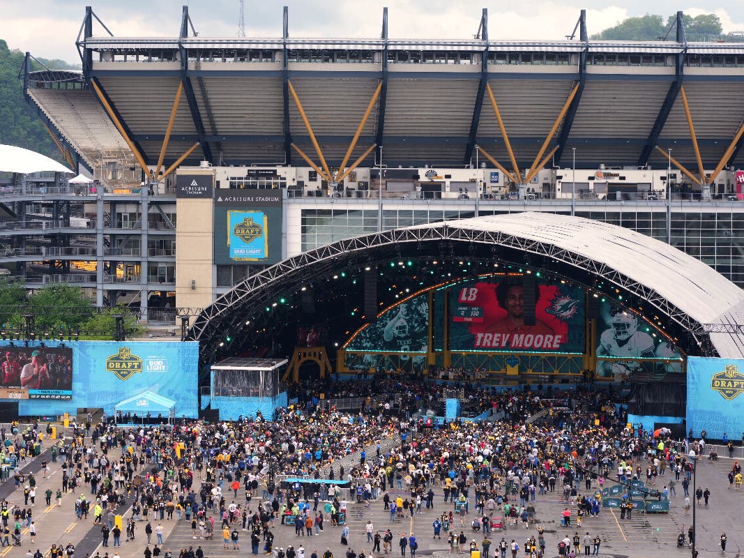 Fans watch at the draft theater during third day of the NFL football draft, Saturday, April 25, 2026, in Pittsburgh.