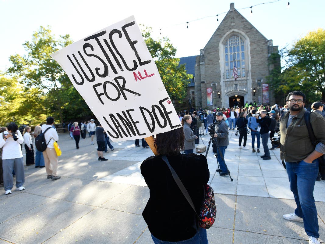 An attendee holds a sign in support of Jane Doe during a protest at Cornell University, Monday, Oct. 5, 2026, in Ithaca, N.Y. 
