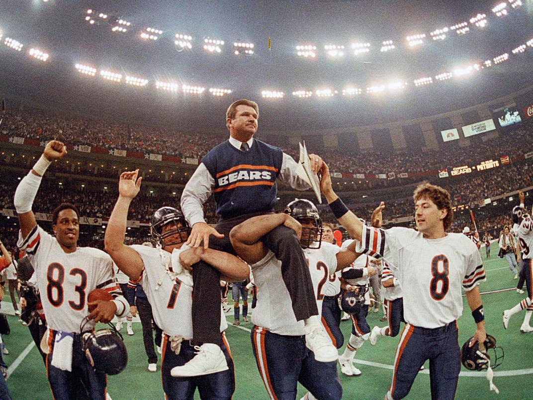In this Jan. 26, 1986, file photo, Chicago Bears coach Mike Ditka is carried off the field by Steve McMichael, left, and William Perry after the Bears defeated the New England Patriots 46-10 in NFL football's Super Bowl XX.