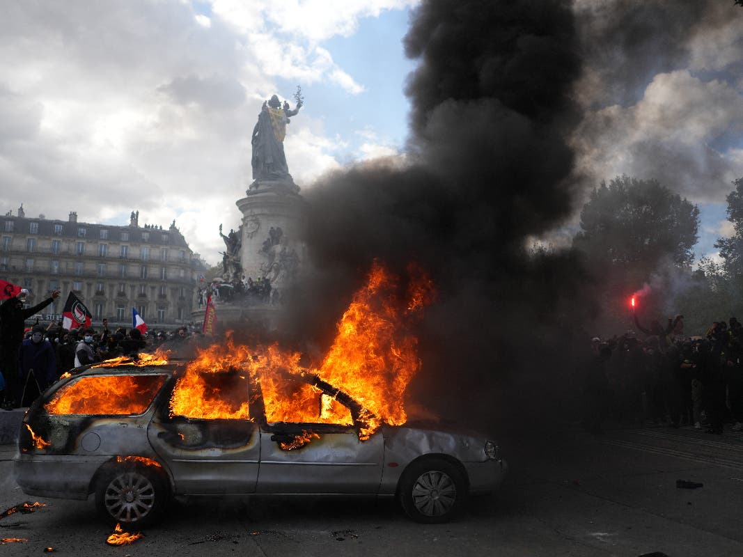 A car burns at Republique square during a protest against rising living costs, joining students' grievances, in Paris, Saturday, Oct. 17, 2026. 
