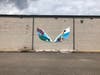 The wings didn't magically appear, they were painted by Lemont Center for the Arts members Neha and Nooriyah