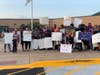 Protests about bullying in the district have been held outside school board meetings.