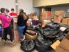 All of the volunteers gathered at the Lemont Township Community Center Nov. 10 to sort, dry and organize thousands and thousands of bottle caps.​