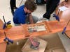  Every year, students at all three Lincoln-Way schools build a model bridge and test its strength in the annual Bridge Building Competition.