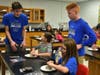 East science teachers and students volunteer their evening to teach students in kindergarten through fourth grade about different science topics.