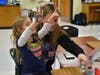 East science teachers and students volunteer their evening to teach students in kindergarten through fourth grade about different science topics.