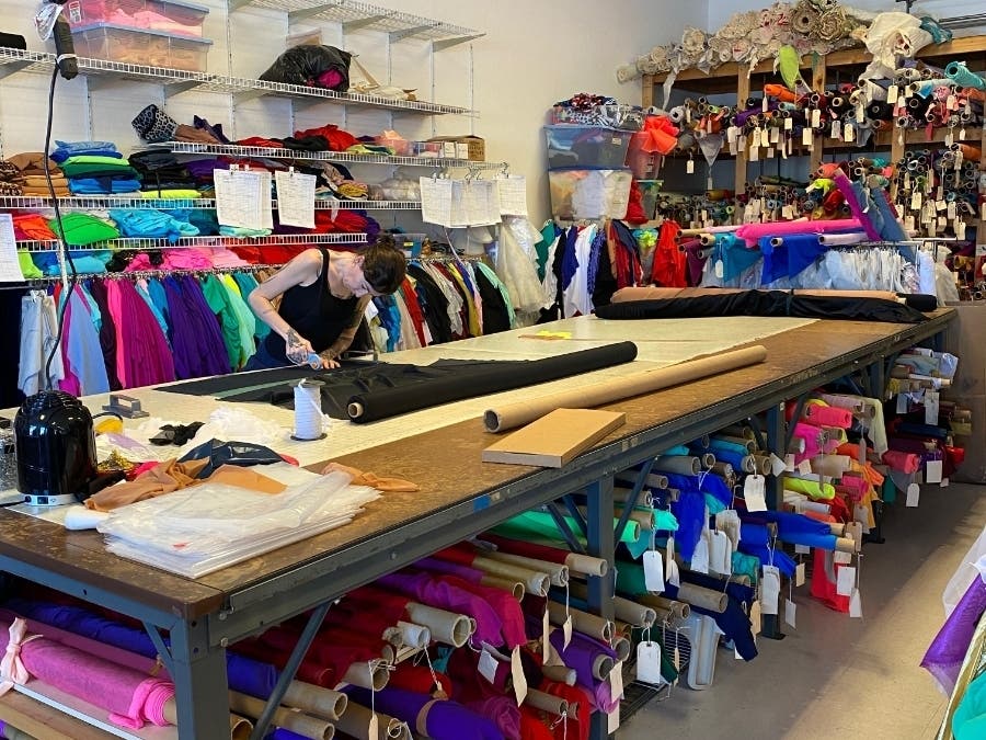 The organizations are employing ballroom gown seamstresses to make the masks. 