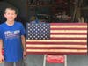 Seth makes the flags entirely himself; cutting the wood, torching it and painting it. 