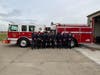 The new apparatus is blessed, then welcomed by pushing it into its new quarters at the fire station.