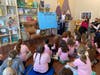 Sandy Sotzen discusses her book "Why Do They Do That?" with Girl Scout Troop 75643.