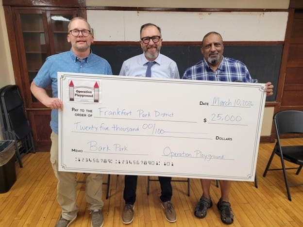 OPF President, Chris Herder, Commissioner Mike McCarey and OPF Secretary David McDonald.