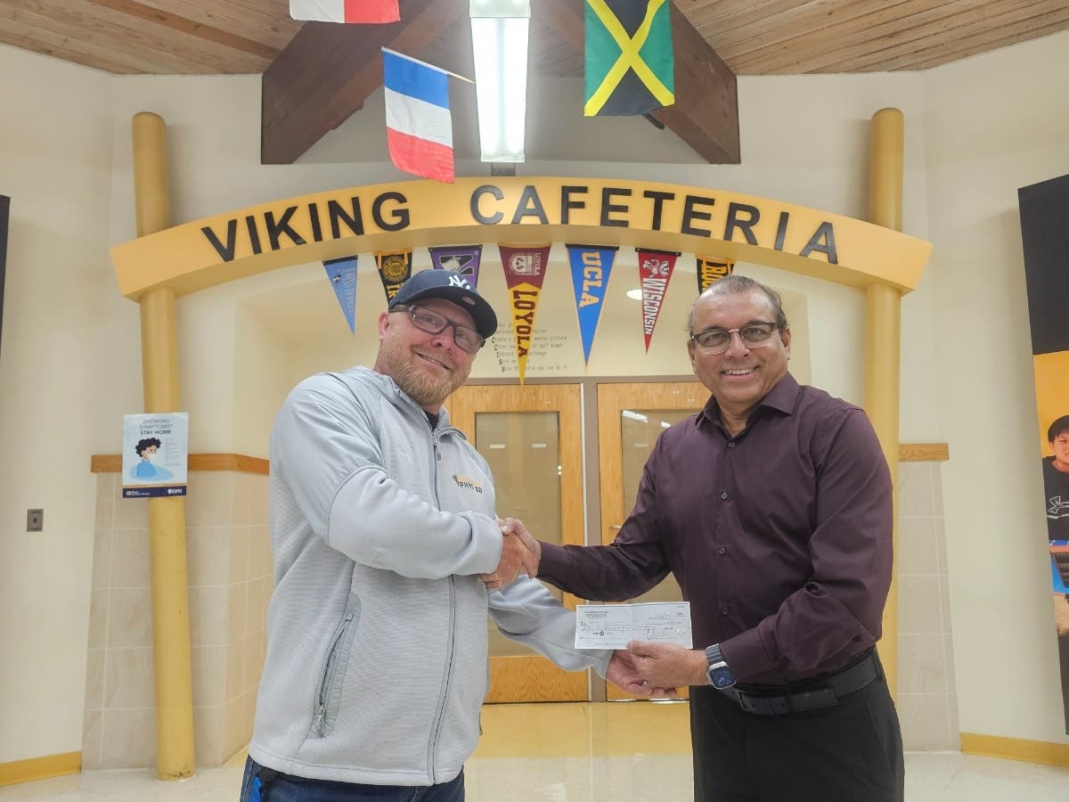Bill Normand, Principal, A.Vito Martinez Middle School; Mohammed Quarshi, Owner and
President, Romeoville Mobil