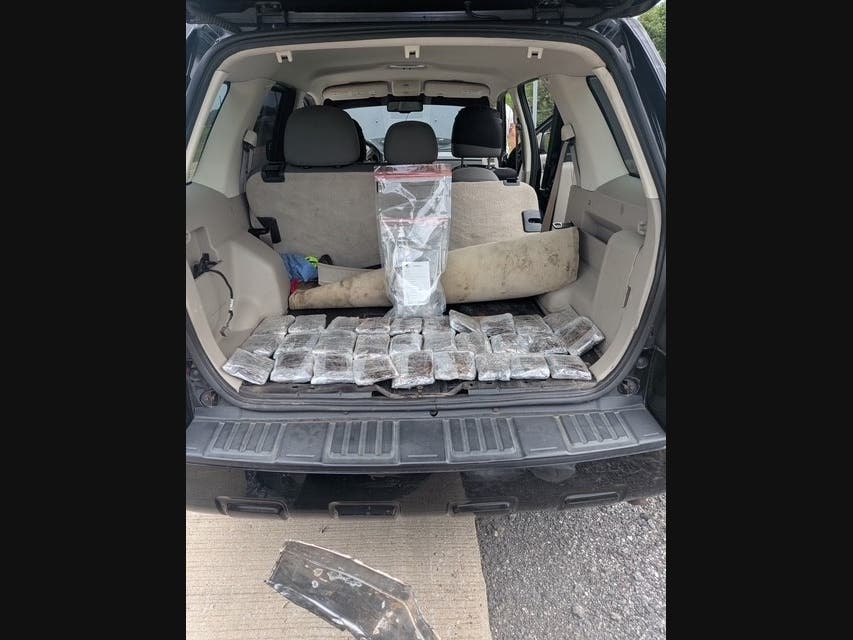 Troopers opened the firepit and discovered 34 cellophane‑wrapped packages consistent with narcotics trafficking, police said.