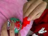 A member of Morristown Area Girl Scouts Troop 94923 creates a holiday ornament for the annual SHARE community service project.
