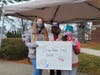Cadettes from Morristown Girl Scouts urged drivers to donate to the drive-thru food drive.
