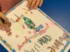 A Daisy from Girl Scout Troop 98191 writes an anonymous pen pal letter to a homeless friend during her Take Action project.