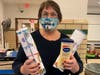 Jane Devlin from Wayside Well shows a sample of anonymous pen pal letters and lotions from Daisy Girl Scout Troop 98191 that were created especially for her homeless friends.