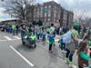 Marchers from Morristown Area Girl Scouts participate in the 2022 Morristown St. Patrick's Day parade.