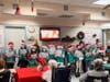 Morristown Area Girl Scouts Junior Troop 97737 entertains residents at Morris View Healthcare Center by singing holiday carols.