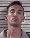 Matthew Sells was charged with impersonating a cop after deputies stopped his car and found a mounted blue light.