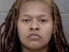 Deonna Wolfe, 21, was charged with carrying a concealed gun and three counts of contributing to the delinquency of a juvenile.
