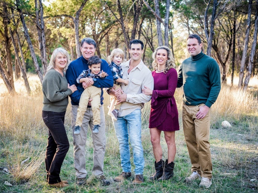 The Mitchell Family, from left to right: Becky, Dewey holding grandson Jimmy, son-in-law James holding grandson Bohdi, daughter Carly, and son Derek.