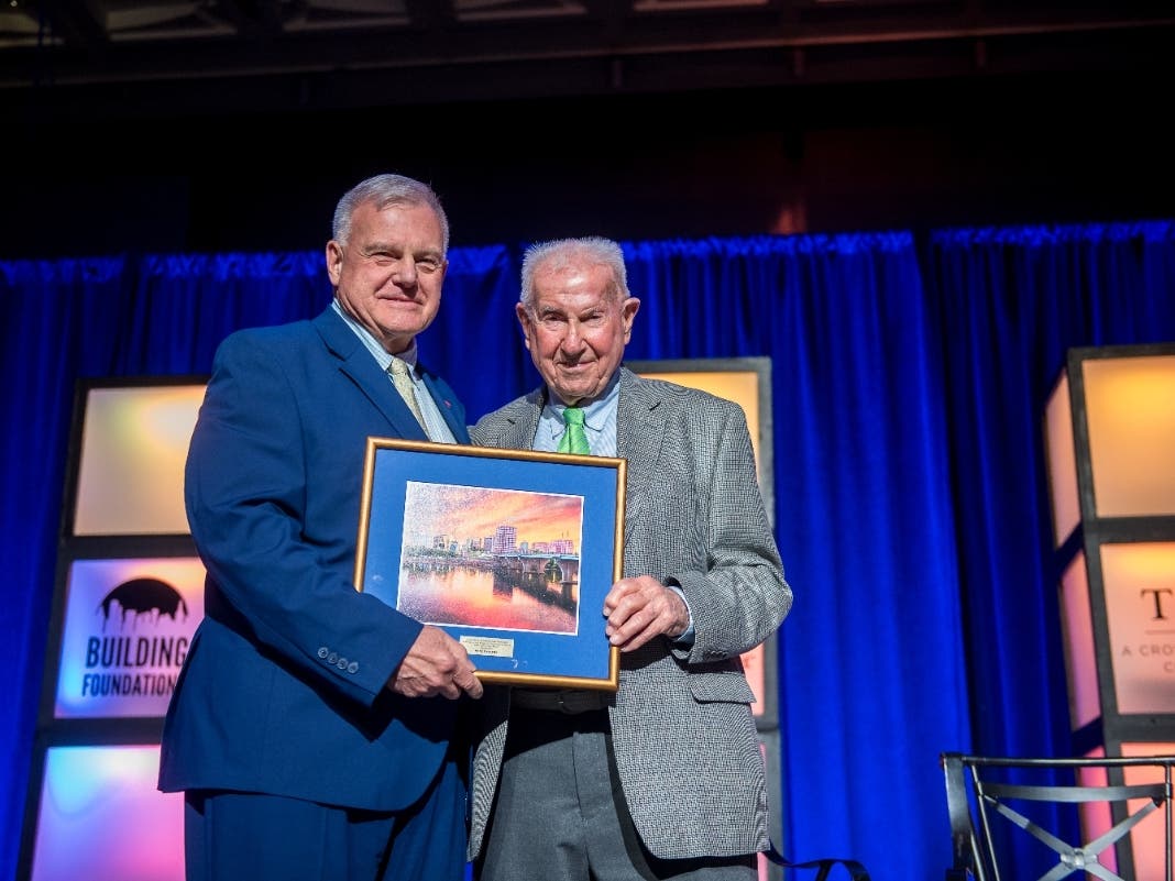 Bill Farley (right), 2023 Jeffrey Digel Award Honoree, presented the 2026 Jeffrey Digel Award to Andy Bessette (left).