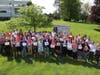Employees of Mandelbaum Salsburg's Roseland office holding signs they made for the Thank You Challenge