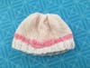 An example of the handmade knitted caps for children, made with love by parishioner Martha Crawford.