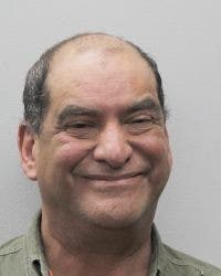 A man is accused of pointing a gun at firefighters during a response to a fire. 