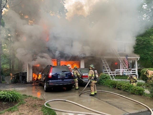 Two residents are displaced after a car fire started in an Oakton home.
