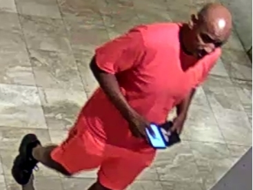 Police are seeking a person of interest after a boy was filmed in a Springfield Town Center bathroom.