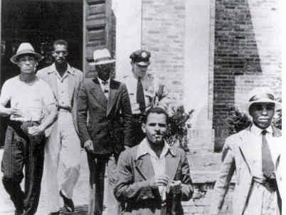 Five African-American men held a sit-in when the Alexandria Library refused to give them library cards.