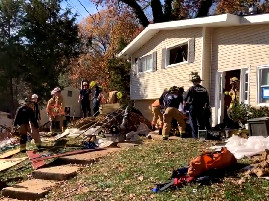 Fire department crews rescued a worker who fell into a 12-foot hole in Rose Hill.