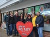 The Del Ray Business Association board presents the Heart of Del Ray to Ms. Preeti's 7-Eleven.