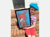 Second grader Barrett Kinzler makes a version of the blue dog portrait inspired by George Rodrigue.