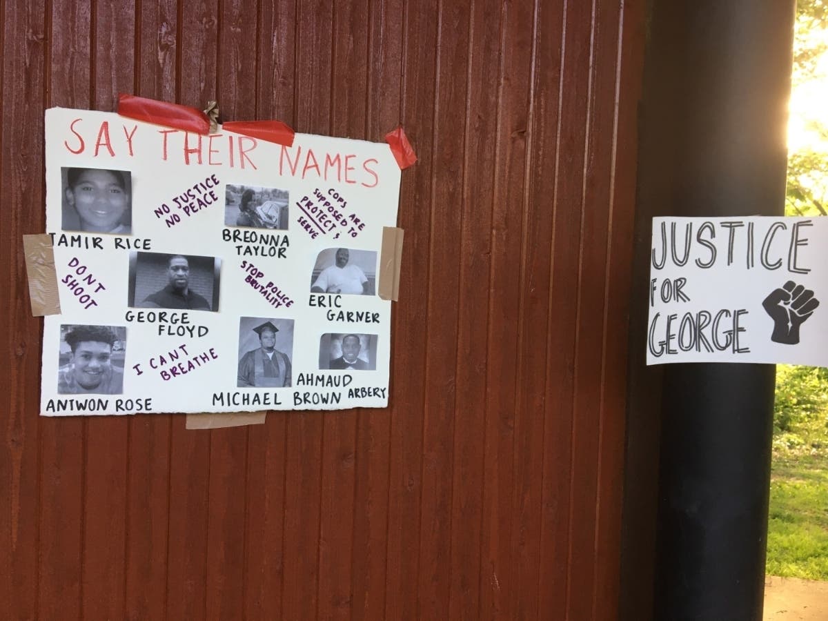 A sign at a June 3 rally in Vienna calls for justice for George Floyd and other black Americans who have died.