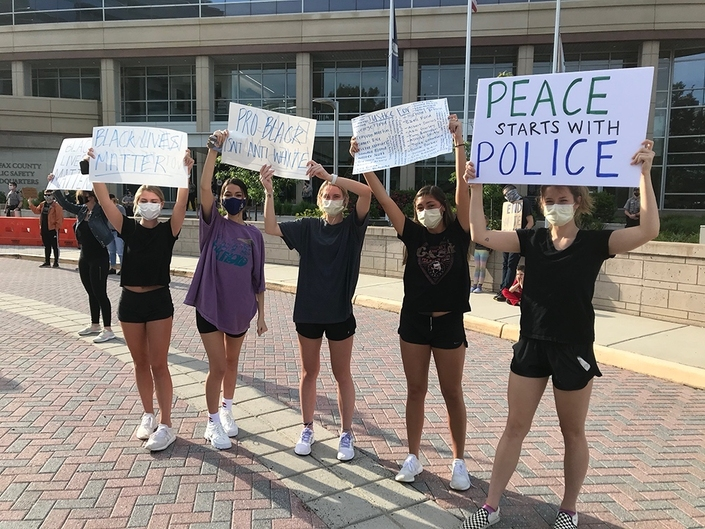 Hundreds gathered Tuesday outside Fairfax County Police headquarters to protest police violence against people of color.