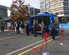 Officials mark the start of passenger service for an autonomous electric shuttle at the Mosaic District.