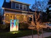 The Holiday Card Lane in Del Ray features oversized holiday cards in front yards.