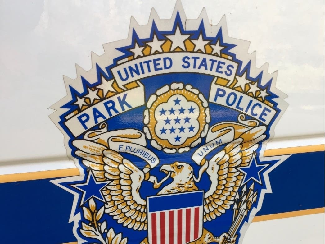 Charges against two U.S. Park Police officers have been dismissed in federal court in the fatal shooting of Bijan Ghaisar. 