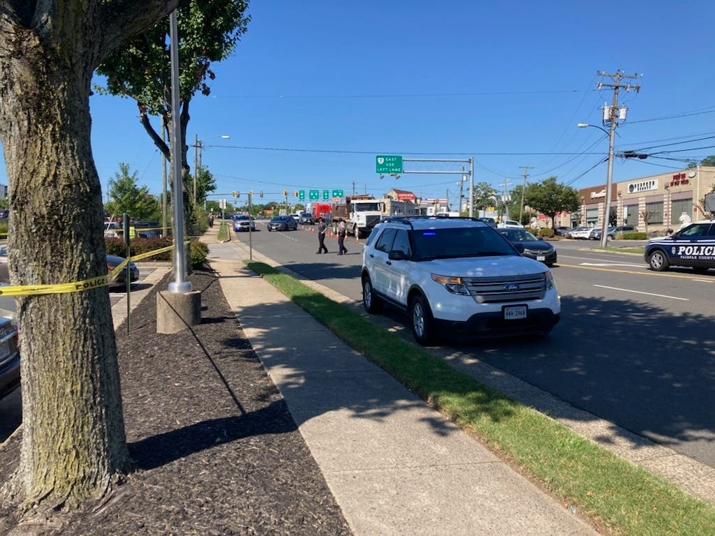 A driver has been charged in the crash that killed a pedestrian in a Seven Corners parking lot on Aug. 18. 